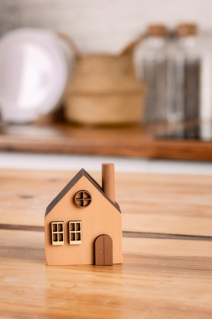 A toy house on the kitchen table.